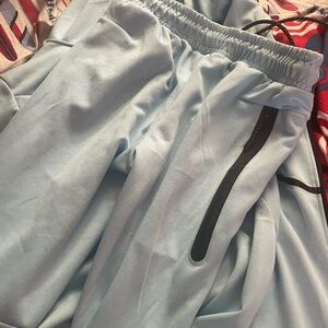 Blue Nike Tech Sweatpants with Elastic Waistband and Drawstring